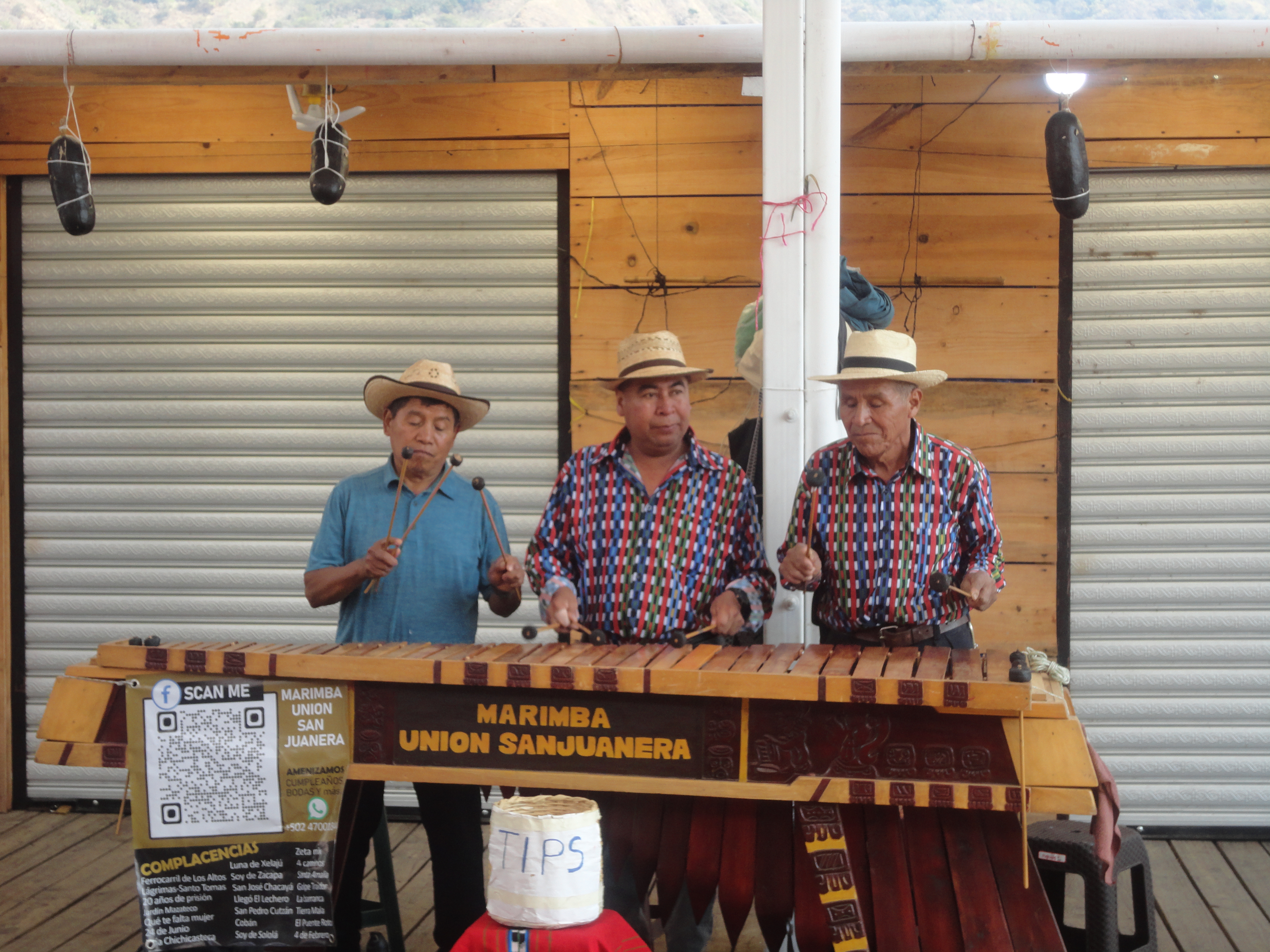 Three men playing Marimba